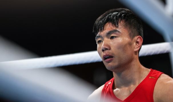 世界杯官方直播平台下载-视网膜两次脱落 胡建关靠毅力站在东奥拳击赛场